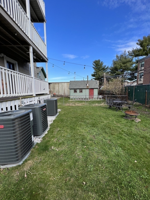 20 Kenton Road, Unit 2 Boston, MA 02130 - Photo 12 of 20 a view of a kitchen with a sink and a table and chairs