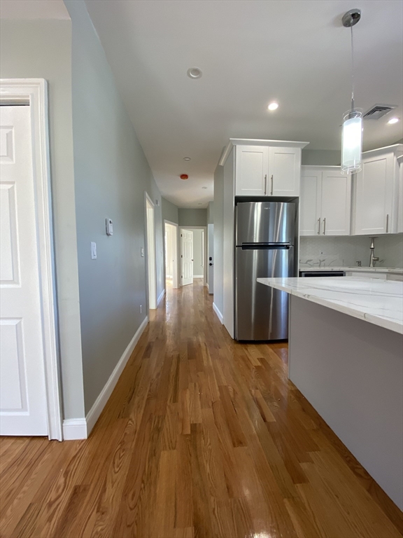 20 Kenton Road, Unit 2 Boston, MA 02130 - Photo 13 of 20 a kitchen with a refrigerator a sink and a stove