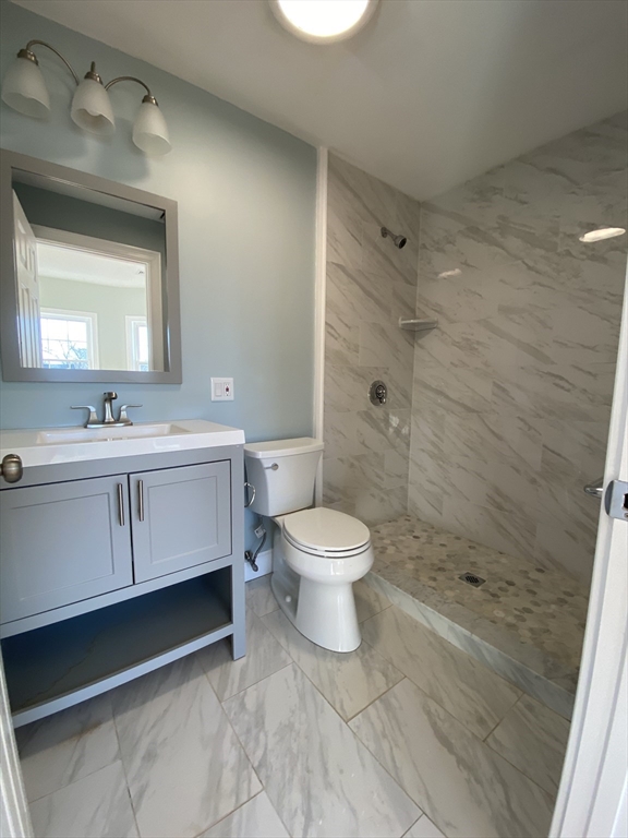 20 Kenton Road, Unit 2 Boston, MA 02130 - Photo 17 of 20 a bathroom with a toilet a sink and shower