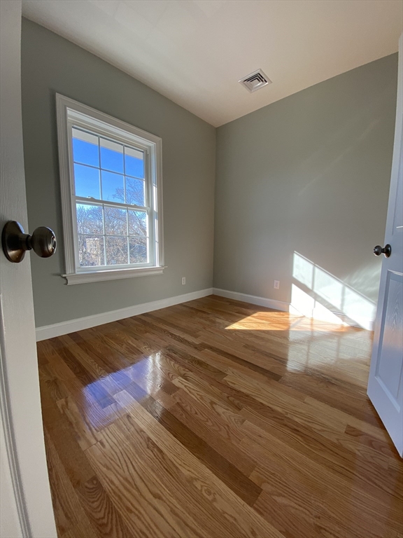 20 Kenton Road, Unit 2 Boston, MA 02130 - Photo 18 of 20 a bedroom with a bed and a window