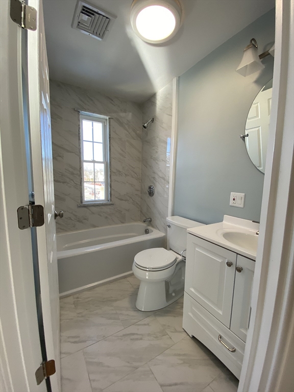 20 Kenton Road, Unit 2 Boston, MA 02130 - Photo 20 of 20 a bathroom with a toilet sink a mirror and shower