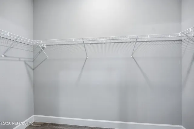 a view of a room with racks on the wall