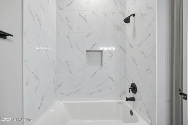 a bathroom with a bathtub