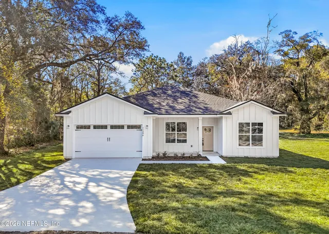 a house with trees in the background