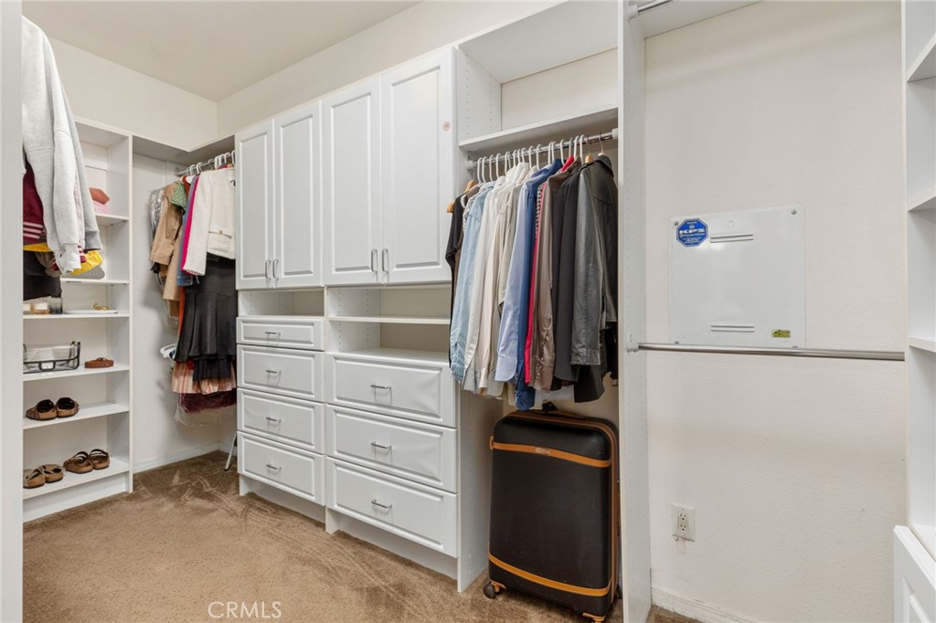 30355 Lamplighter Lane Menifee, CA 92584 - Photo 13 of 31 a view of walk in closet with clothes and shoes