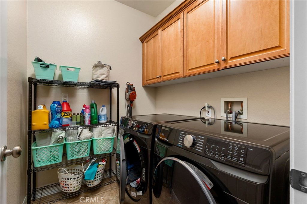 30355 Lamplighter Lane Menifee, CA 92584 - Photo 20 of 31 a utility room with dryer and washer