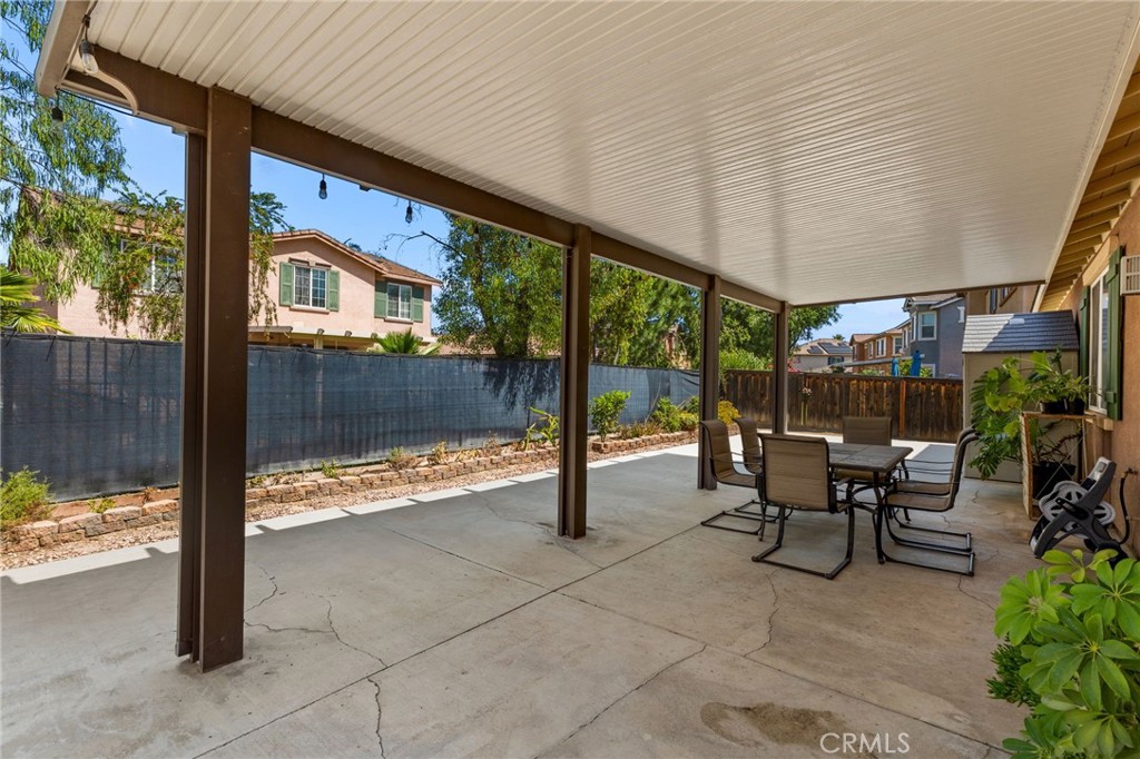 30355 Lamplighter Lane Menifee, CA 92584 - Photo 25 of 31 a view of a porch with chairs and backyard