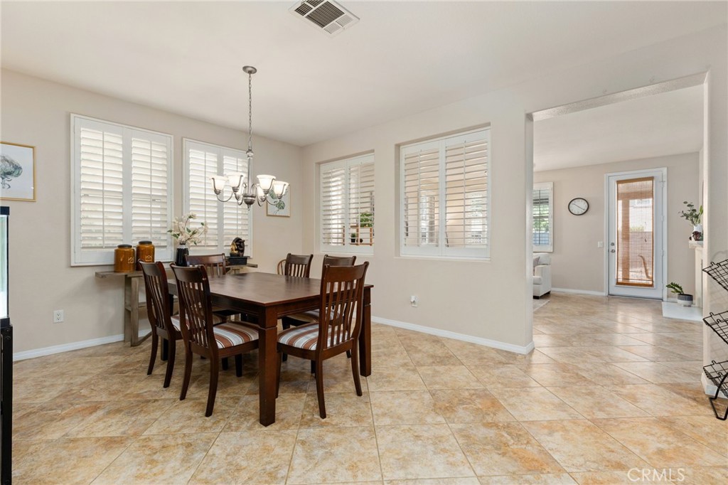 30355 Lamplighter Lane Menifee, CA 92584 - Photo 9 of 31 a view of a dining room with furniture and window
