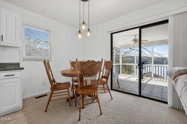 a dining room with furniture and window