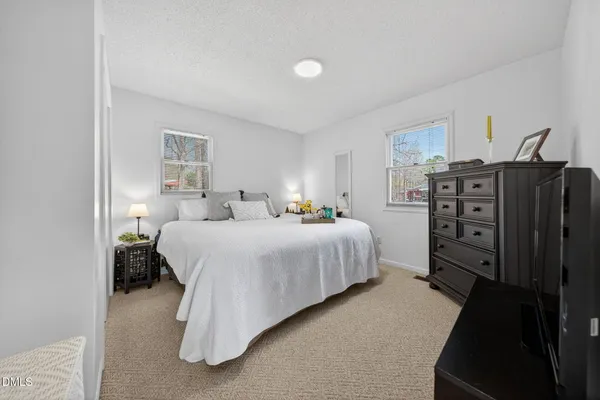 a bedroom with a bed and closet