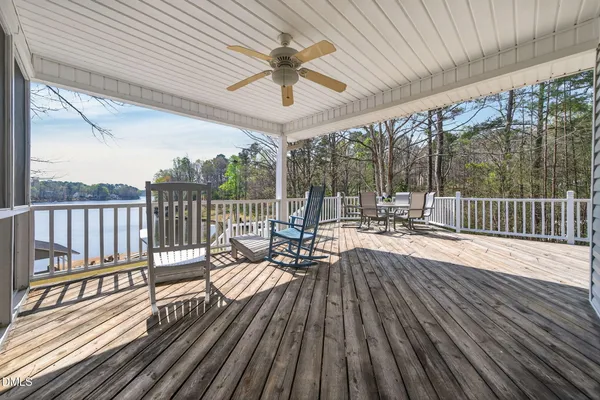 a view of deck with wooden floor and outdoor seating