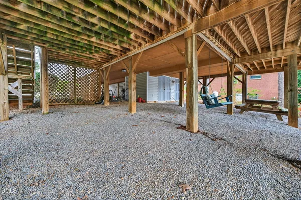 a view of a room with wooden walls