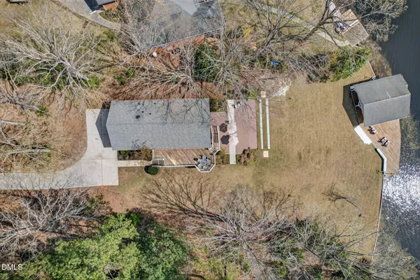 an aerial view of a house with outdoor space