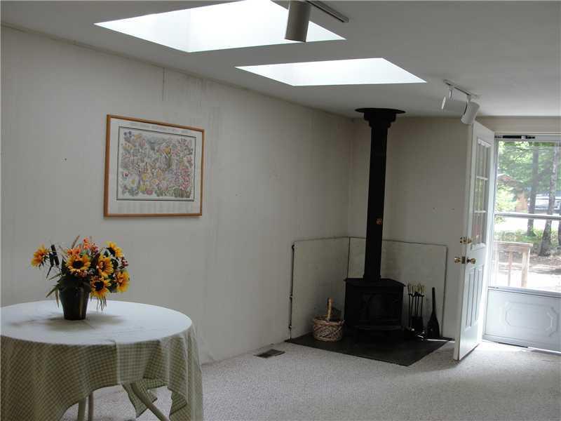 48 North Bay Road Bridgton, ME 04009 - Photo 7 of 26 Living Room. Living area has wood...