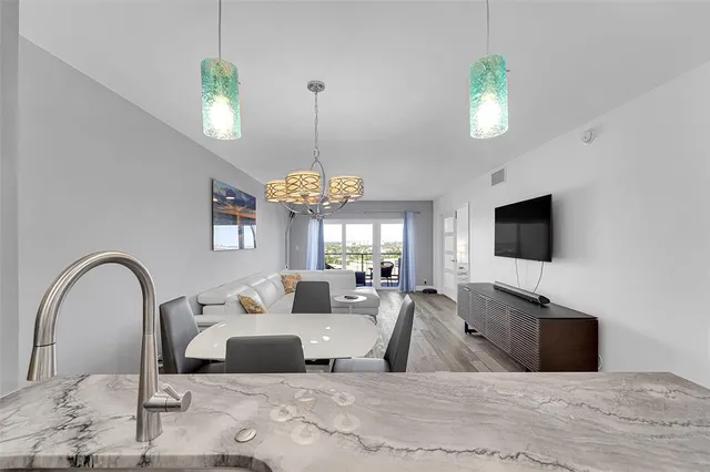 a view of a livingroom with furniture and a flat screen tv
