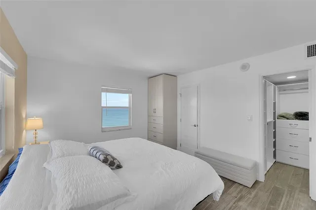 a bedroom with a bed and a closet