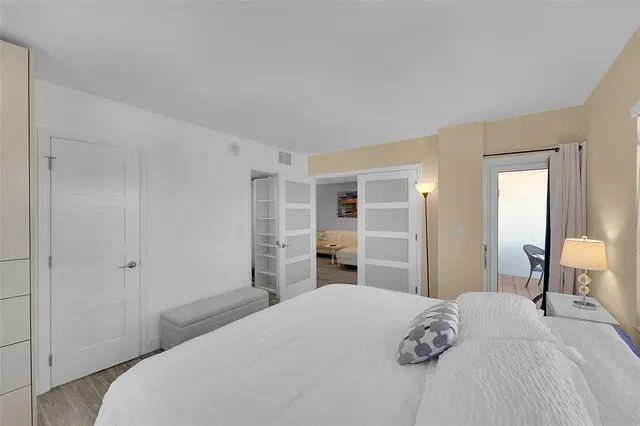 a bedroom with a bed and a cabinets