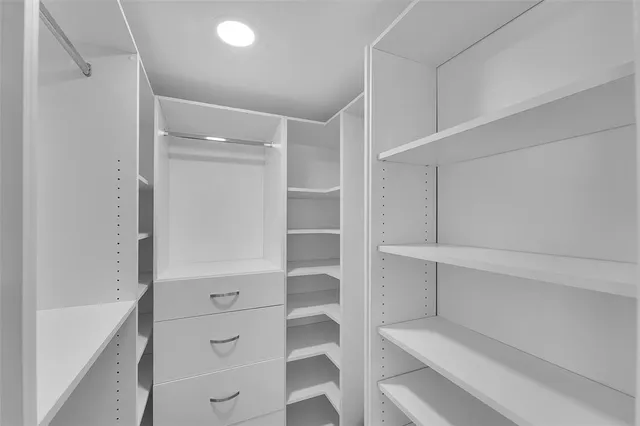 a view of an empty walk in closet