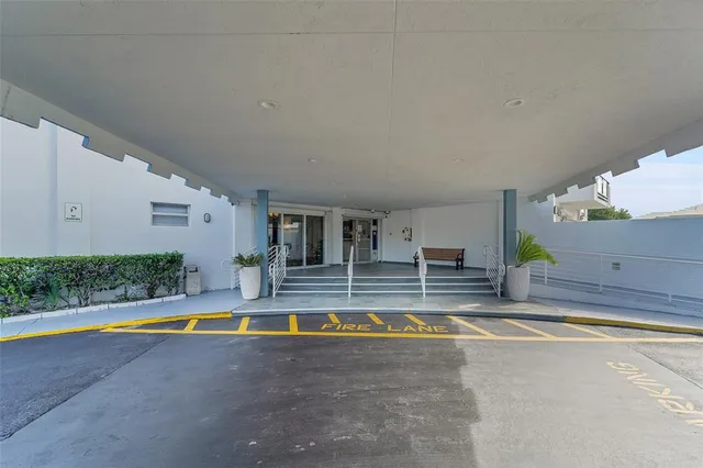 a view of swimming pool with sitting area and tub