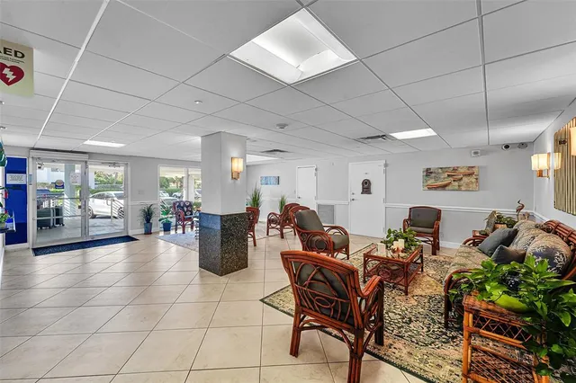 a living room with lots of furniture and a chandelier