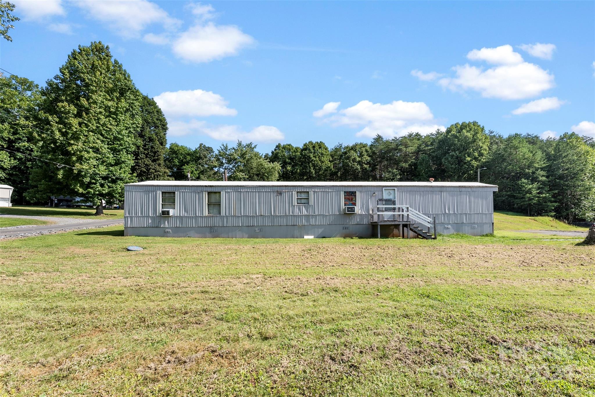 1148 Wagon Wheel Road Hickory, NC 28602 - Photo 19 of 35 a front view of a house with a yard