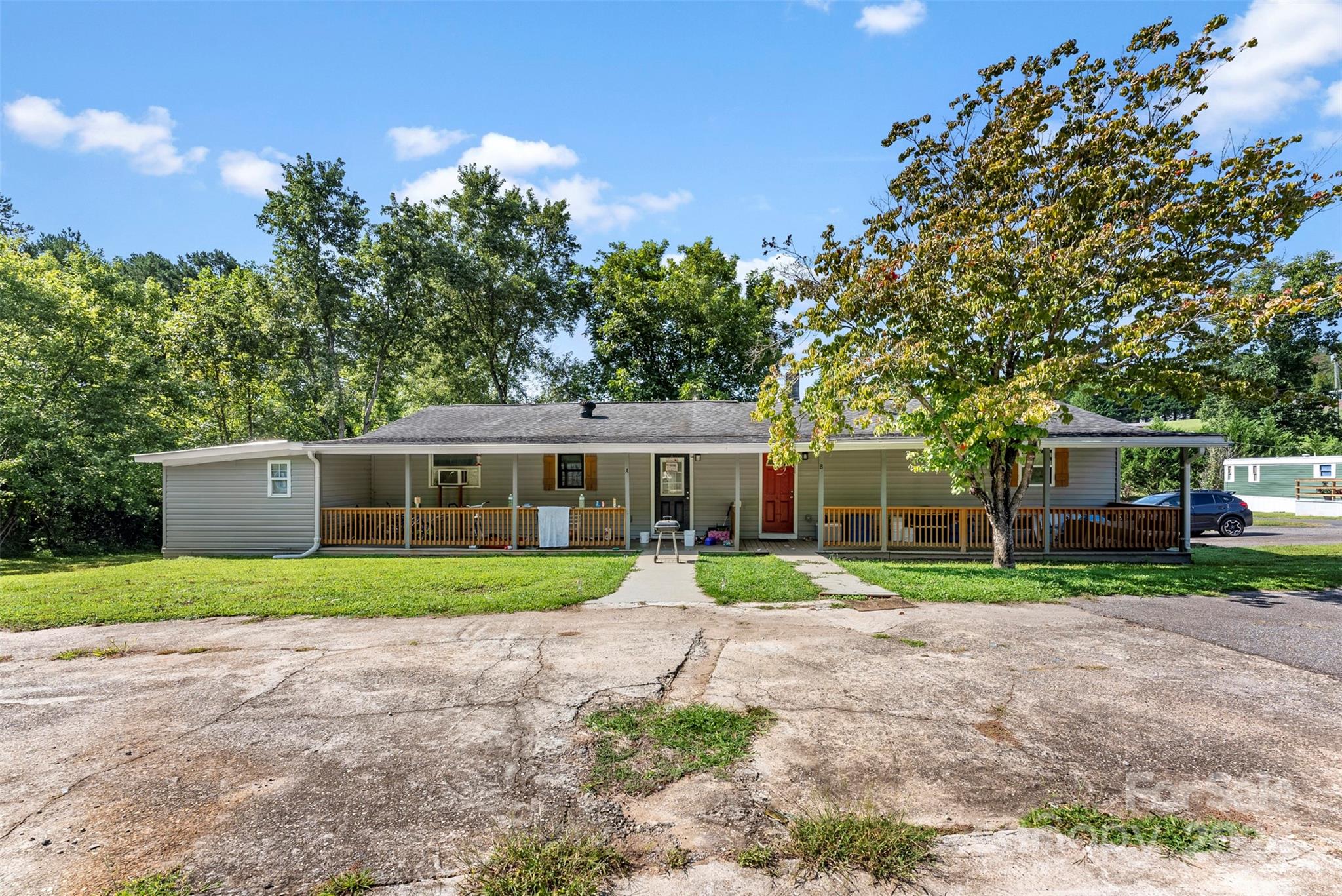 1148 Wagon Wheel Road Hickory, NC 28602 - Photo 2 of 35 a front view of a house with a yard and trees
