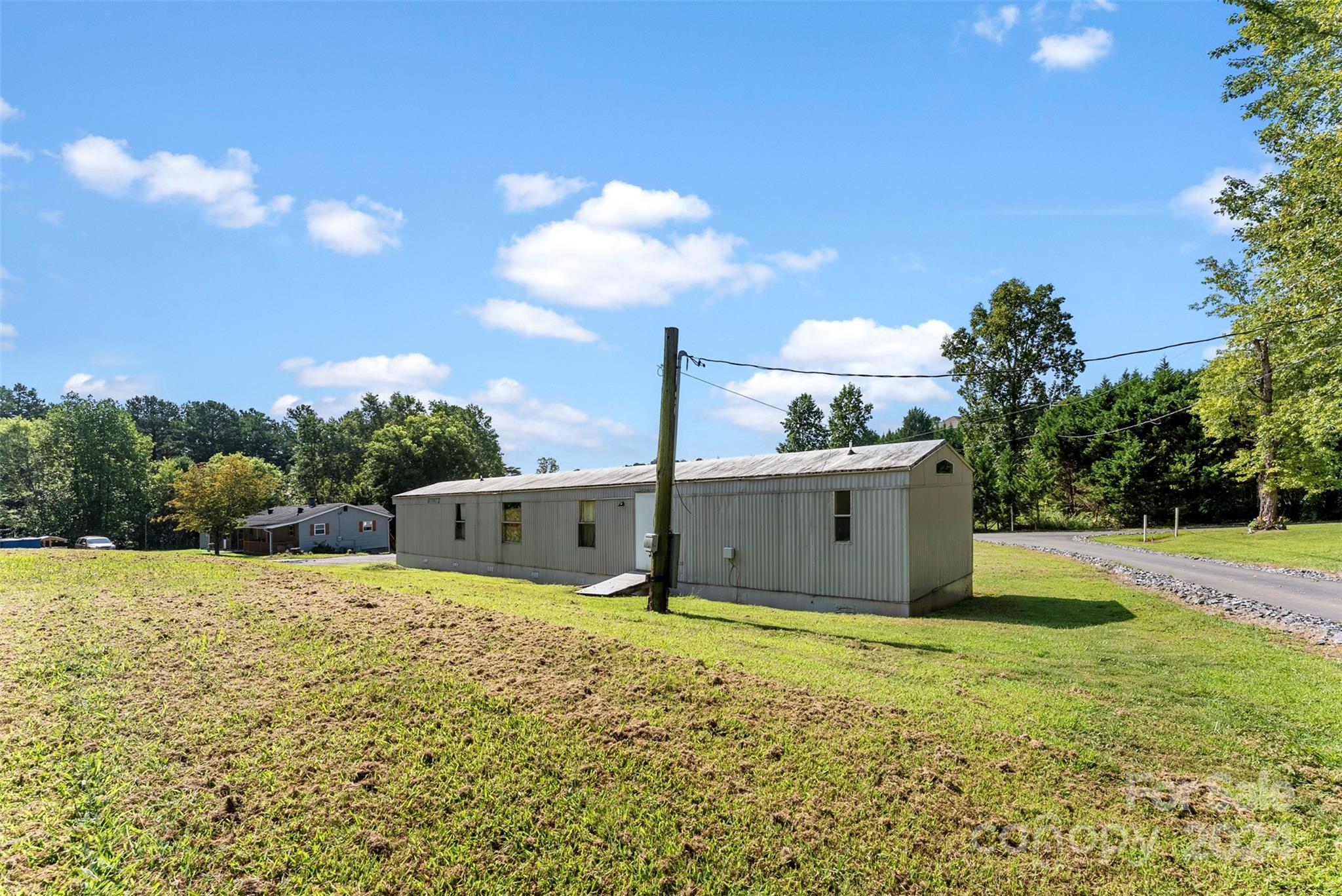1148 Wagon Wheel Road Hickory, NC 28602 - Photo 21 of 35 a view of a house with a yard