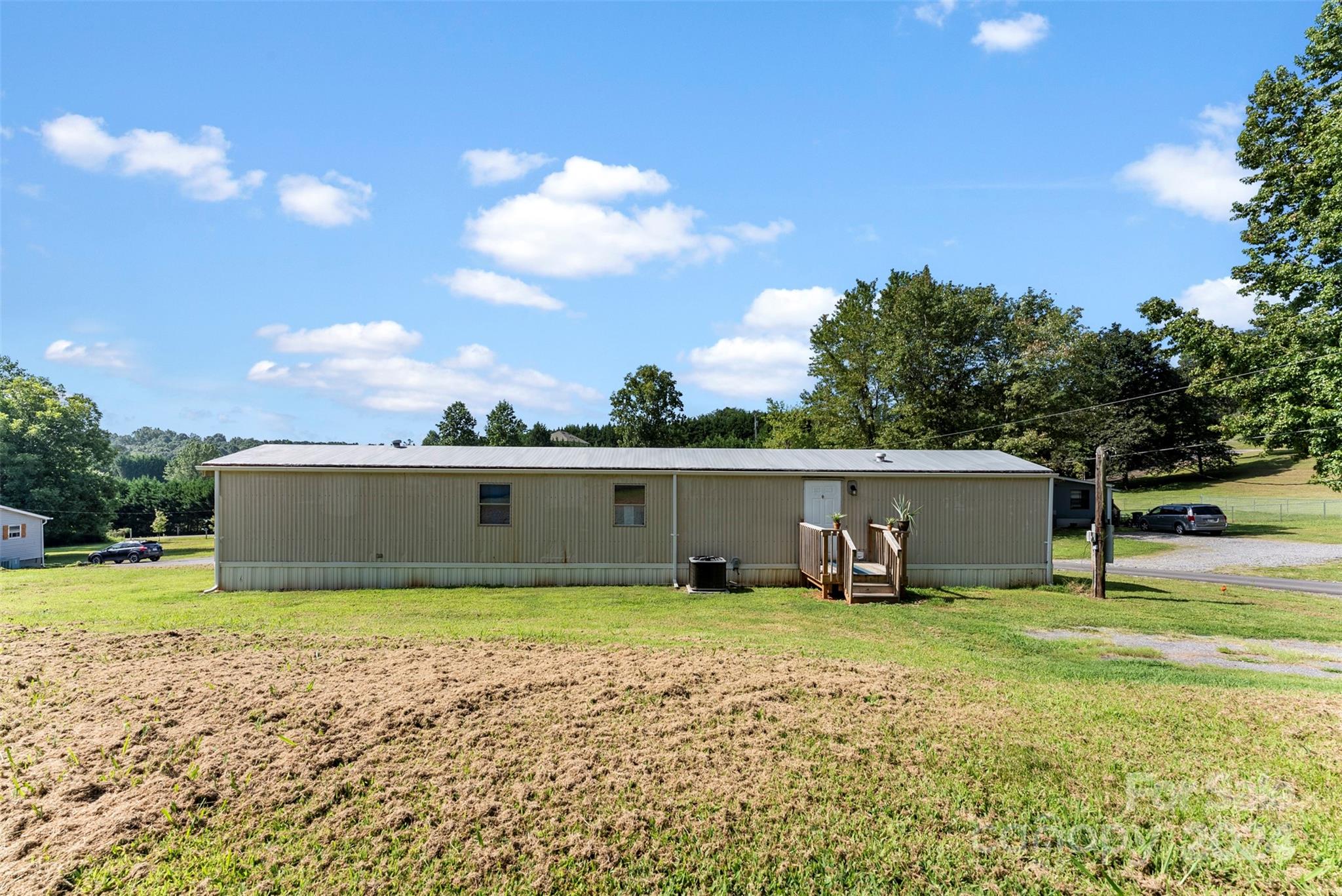 1148 Wagon Wheel Road Hickory, NC 28602 - Photo 24 of 35 a view of a swimming pool with a yard