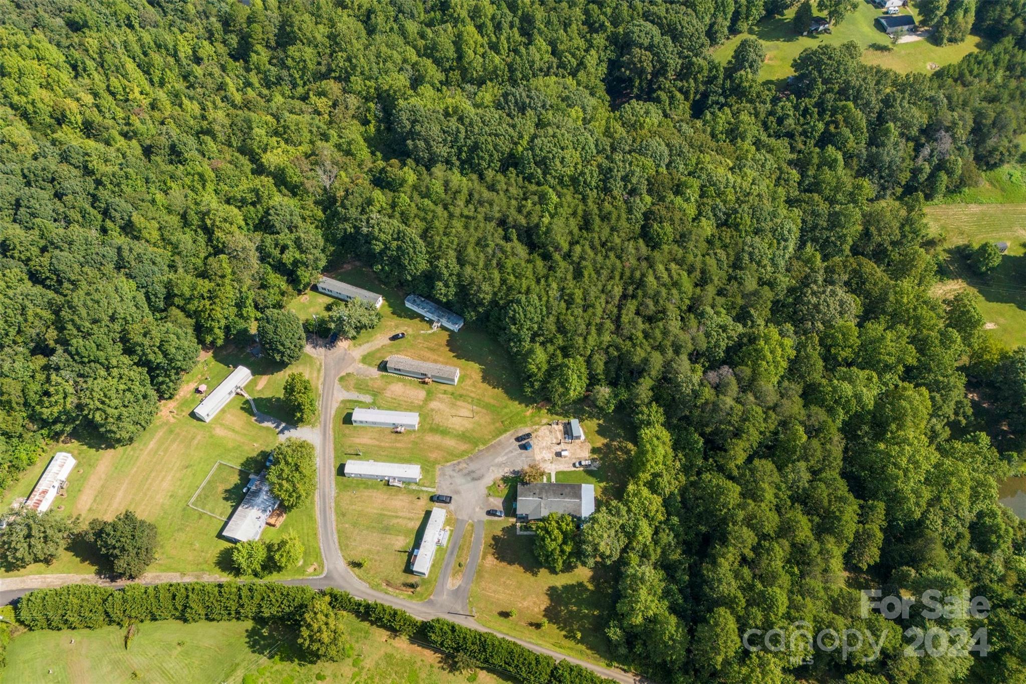 1148 Wagon Wheel Road Hickory, NC 28602 - Photo 3 of 35 an aerial view of a residential houses with yard