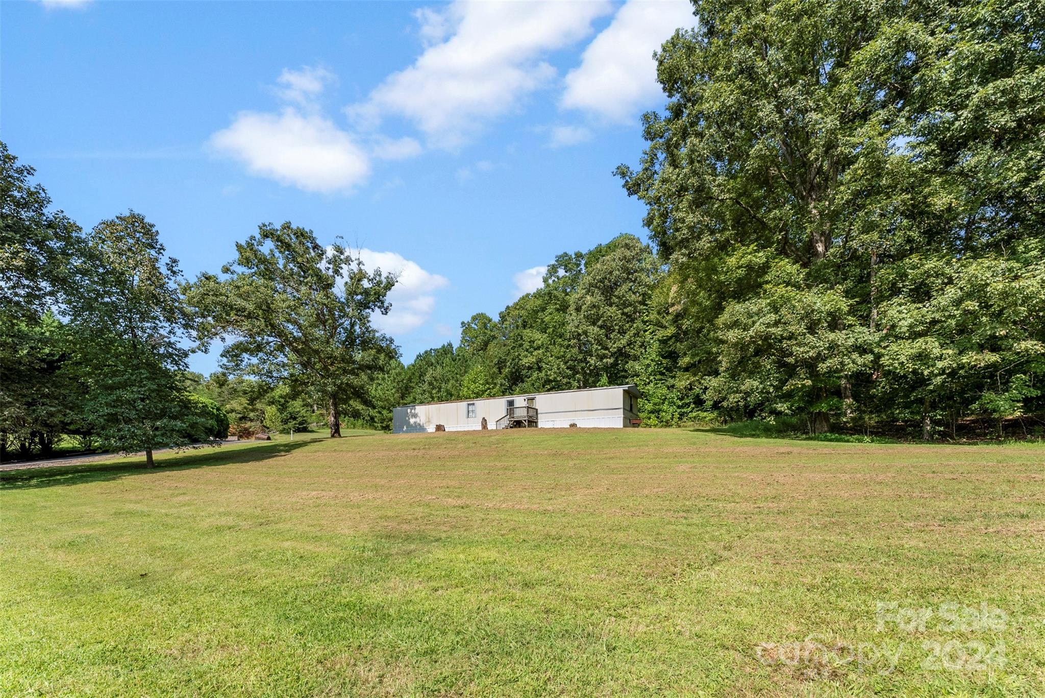 1148 Wagon Wheel Road Hickory, NC 28602 - Photo 31 of 35 a view of a swimming pool with an outdoor space and seating area