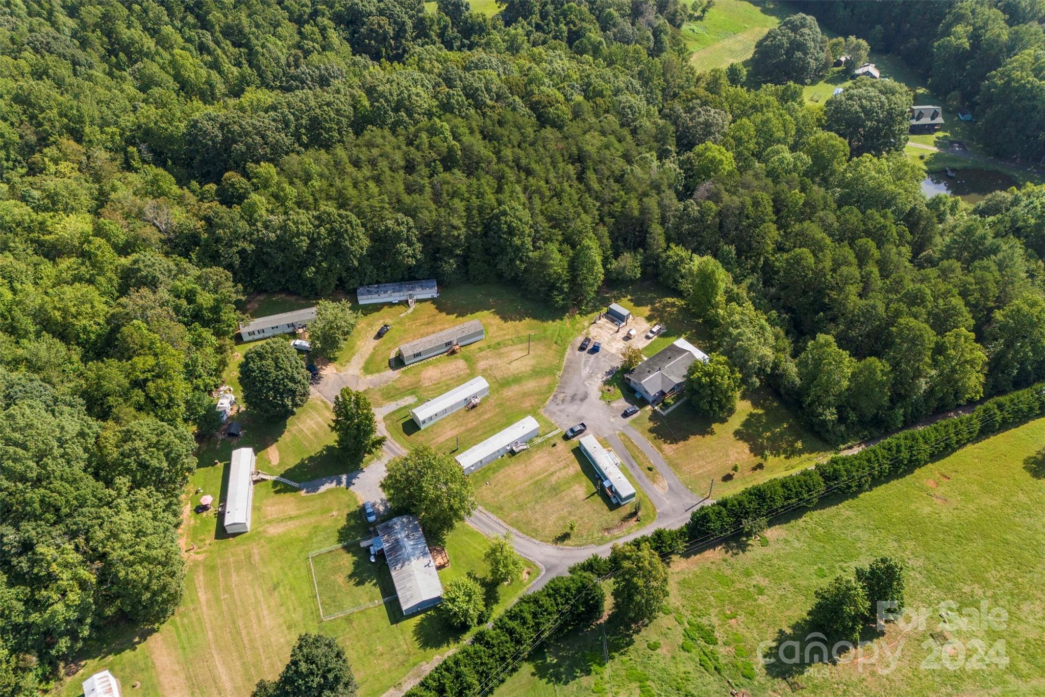 1148 Wagon Wheel Road Hickory, NC 28602 - Photo 4 of 35 an aerial view of residential houses with outdoor space