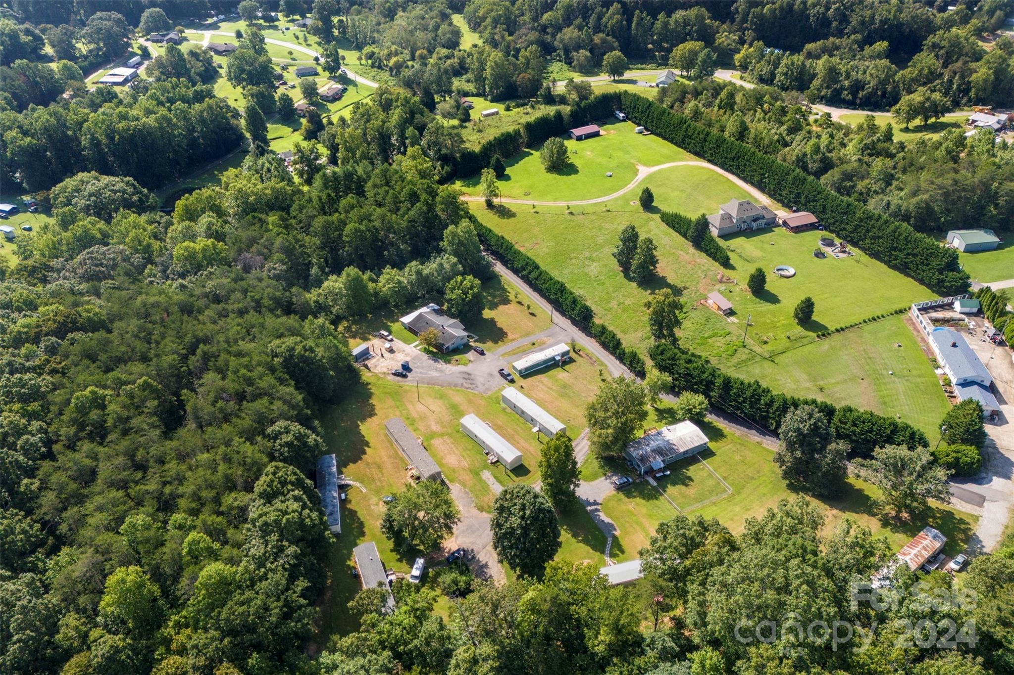 1148 Wagon Wheel Road Hickory, NC 28602 - Photo 5 of 35 an aerial view of a house with a yard and swimming pool