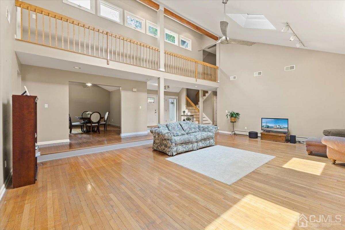 18 Lance Road Lebanon, NJ 08833 - Photo 11 of 45 a living room with furniture and a wooden floor