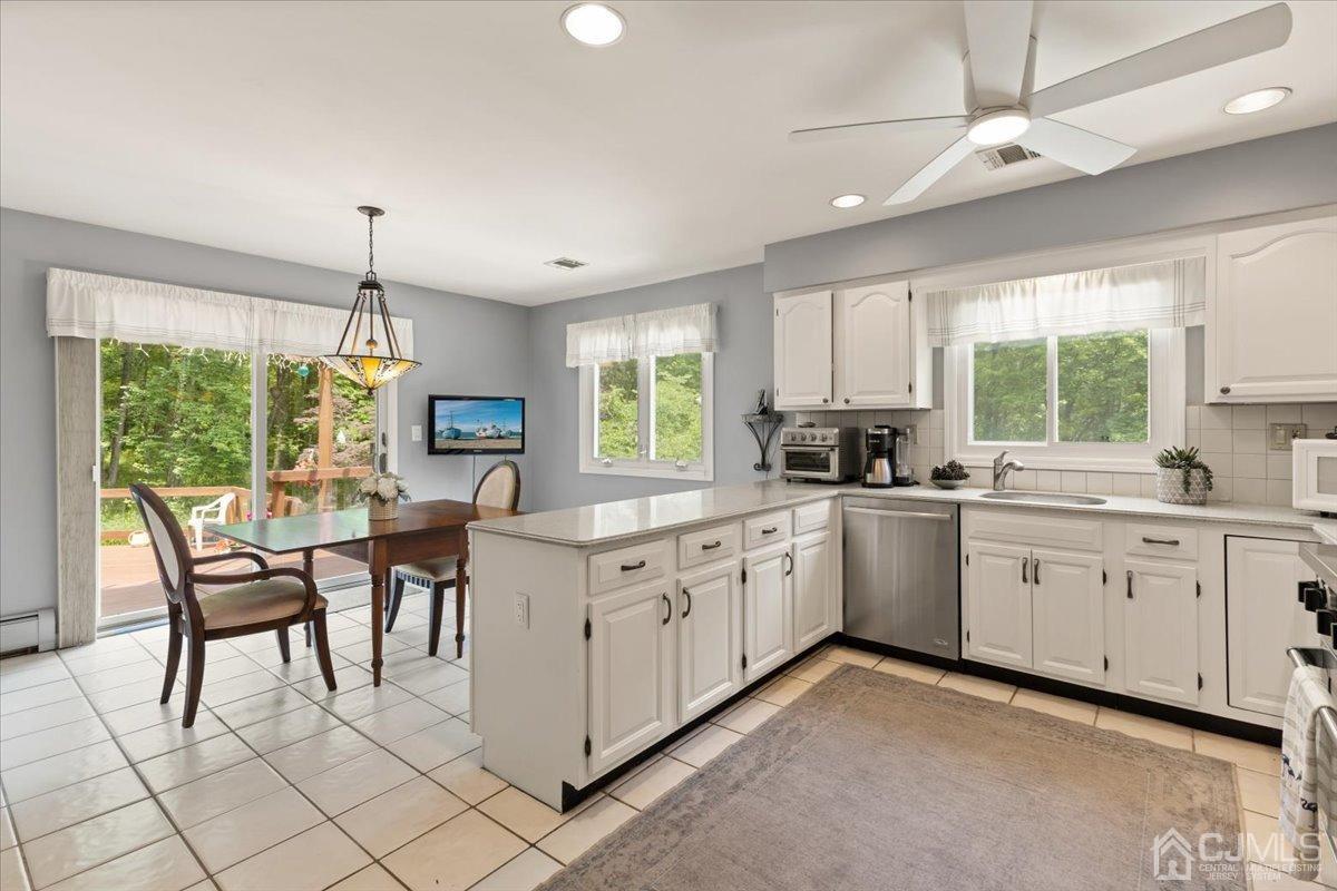 18 Lance Road Lebanon, NJ 08833 - Photo 14 of 45 a kitchen with white cabinets and sink