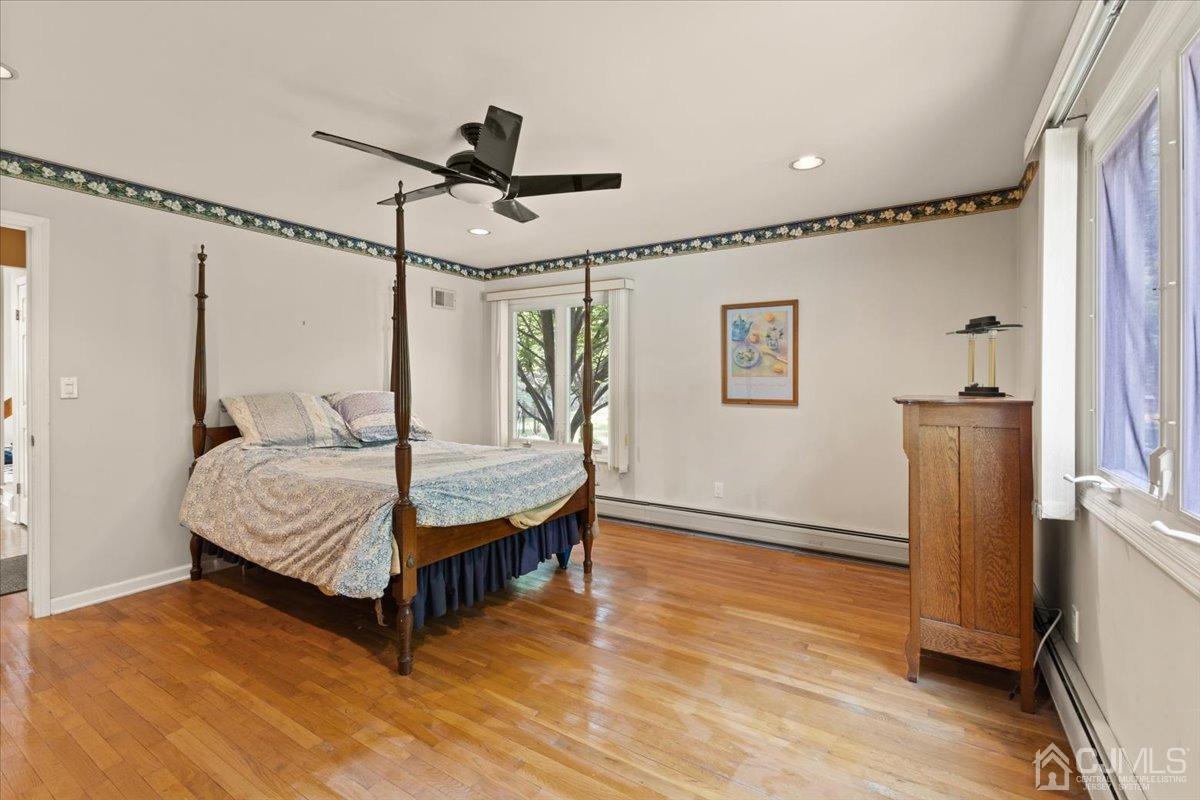 18 Lance Road Lebanon, NJ 08833 - Photo 16 of 45 a bedroom with a bed mirror and a window