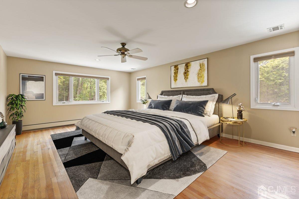 18 Lance Road Lebanon, NJ 08833 - Photo 18 of 45 a bedroom with a bed and wooden floor