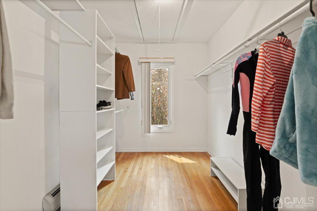 18 Lance Road Lebanon, NJ 08833 - Photo 19 of 45 a view of walk in closet with clothes and shoes