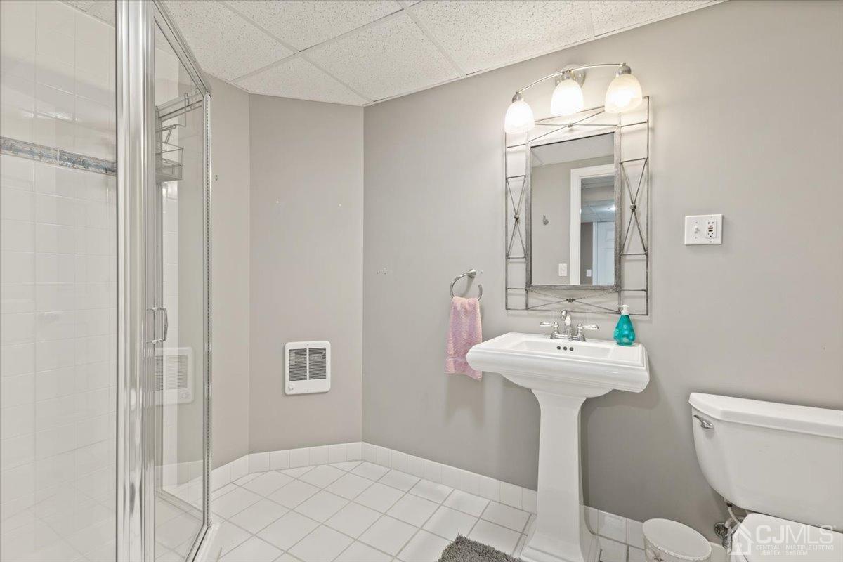 18 Lance Road Lebanon, NJ 08833 - Photo 27 of 45 a bathroom with a sink a toilet and mirror