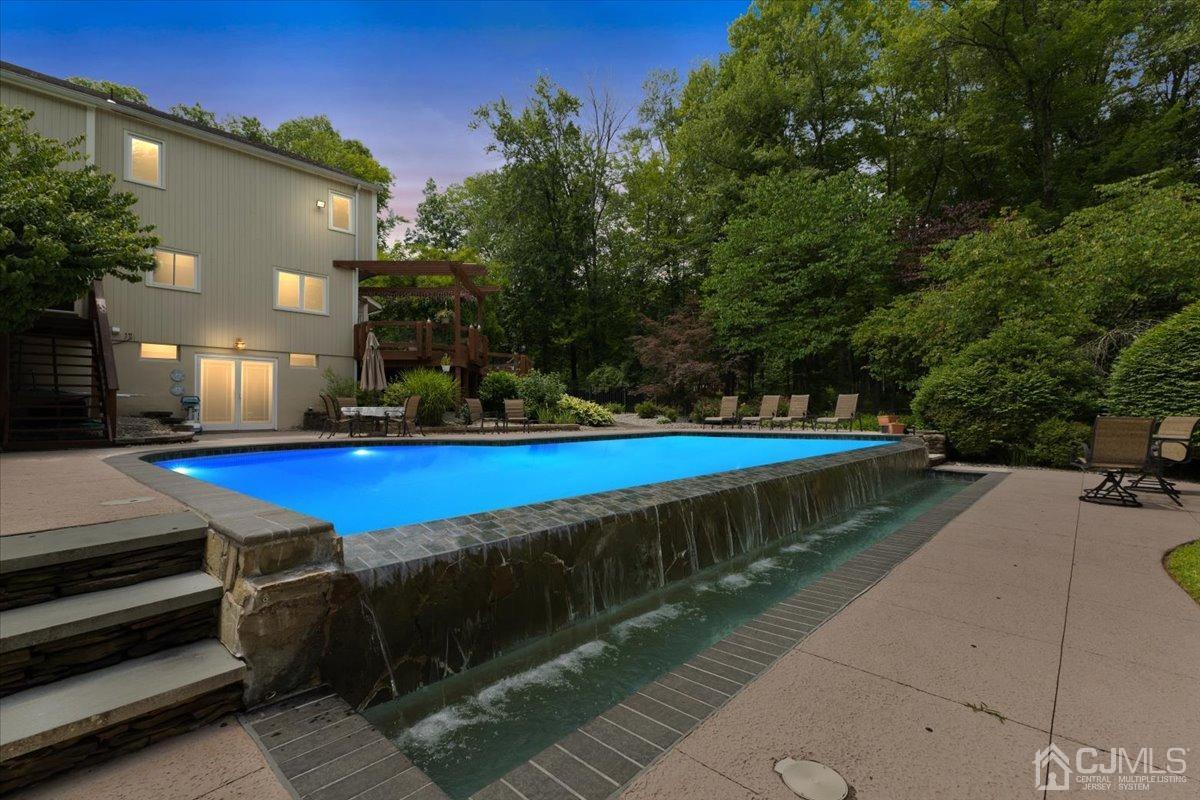 18 Lance Road Lebanon, NJ 08833 - Photo 3 of 45 a view of a swimming pool with a yard