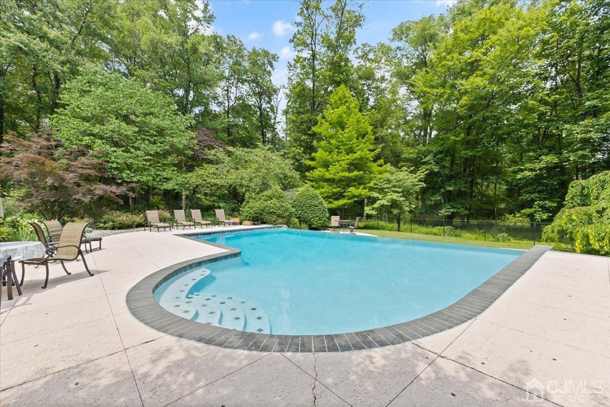 18 Lance Road Lebanon, NJ 08833 - Photo 33 of 45 a view of a swimming pool with a sitting space