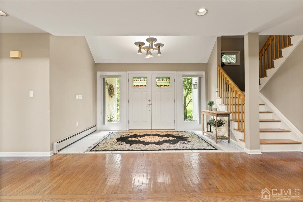 18 Lance Road Lebanon, NJ 08833 - Photo 6 of 45 a view of a livingroom with wooden floor and stairs