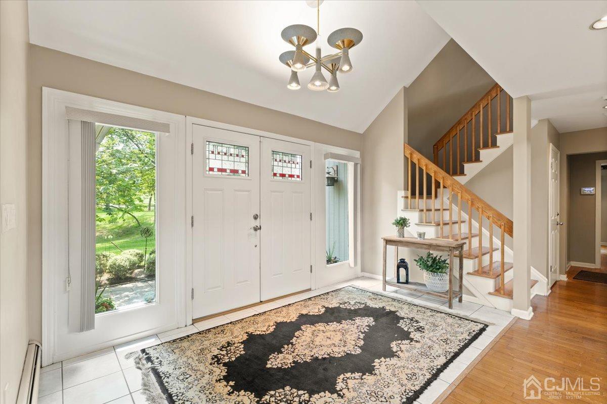 18 Lance Road Lebanon, NJ 08833 - Photo 7 of 45 a view of a hallway with wooden floor and a dining table