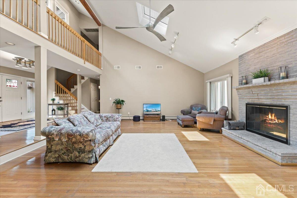18 Lance Road Lebanon, NJ 08833 - Photo 10 of 45 a living room with furniture and a fireplace
