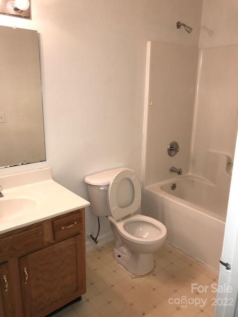 8232 Fox Swamp Road Charlotte, NC 28215 - Photo 11 of 19 a bathroom with a toilet a sink and a bathtub