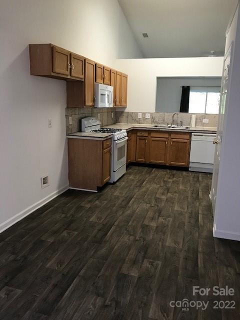 8232 Fox Swamp Road Charlotte, NC 28215 - Photo 13 of 19 a kitchen with stainless steel appliances a sink and a stove