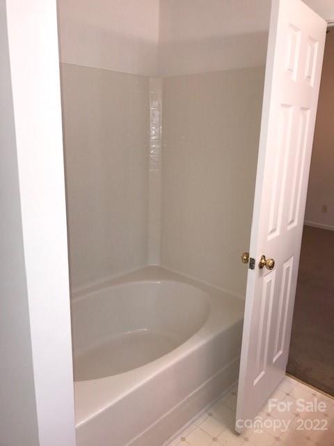 8232 Fox Swamp Road Charlotte, NC 28215 - Photo 18 of 19 a bath tub sitting next to a shower