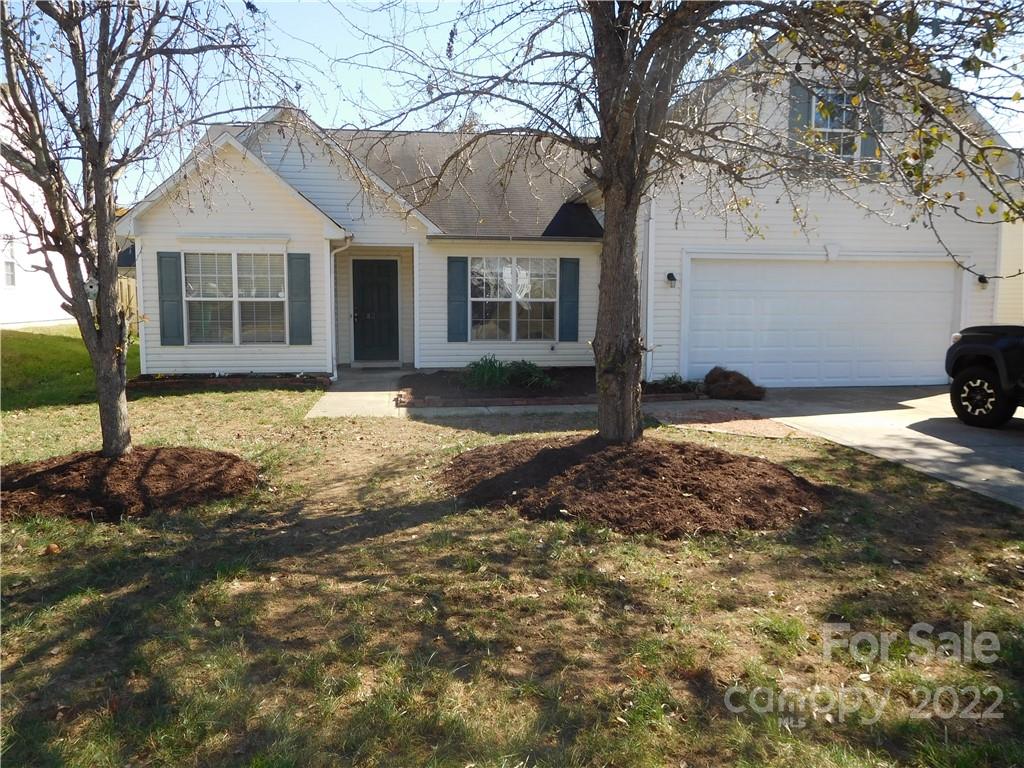 8232 Fox Swamp Road Charlotte, NC 28215 - Photo 2 of 19 a view of a house with a yard covered in snow