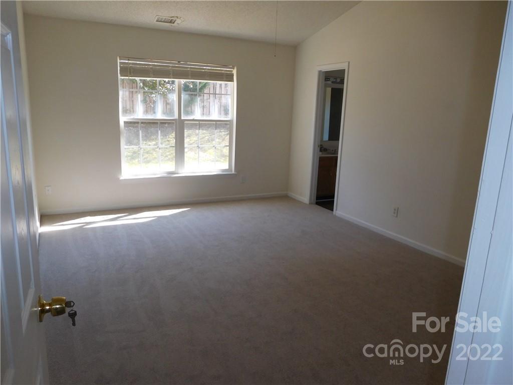 8232 Fox Swamp Road Charlotte, NC 28215 - Photo 5 of 19 an empty room with a window