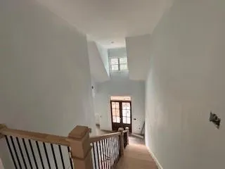 a view of a hallway with windows