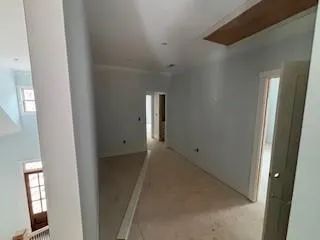 a view of an empty room with windows